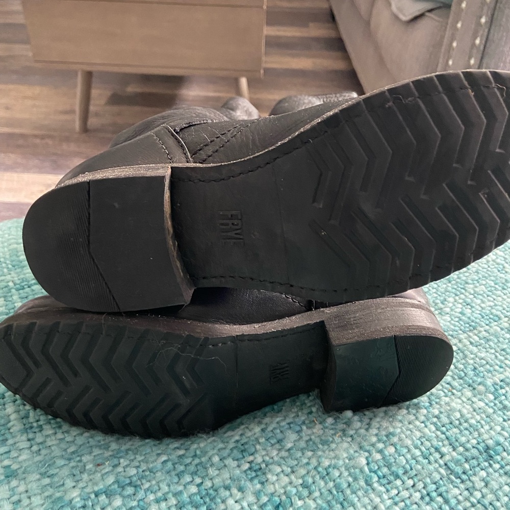 Frye moto boots come up to just below the knee. Very little wear on soles.